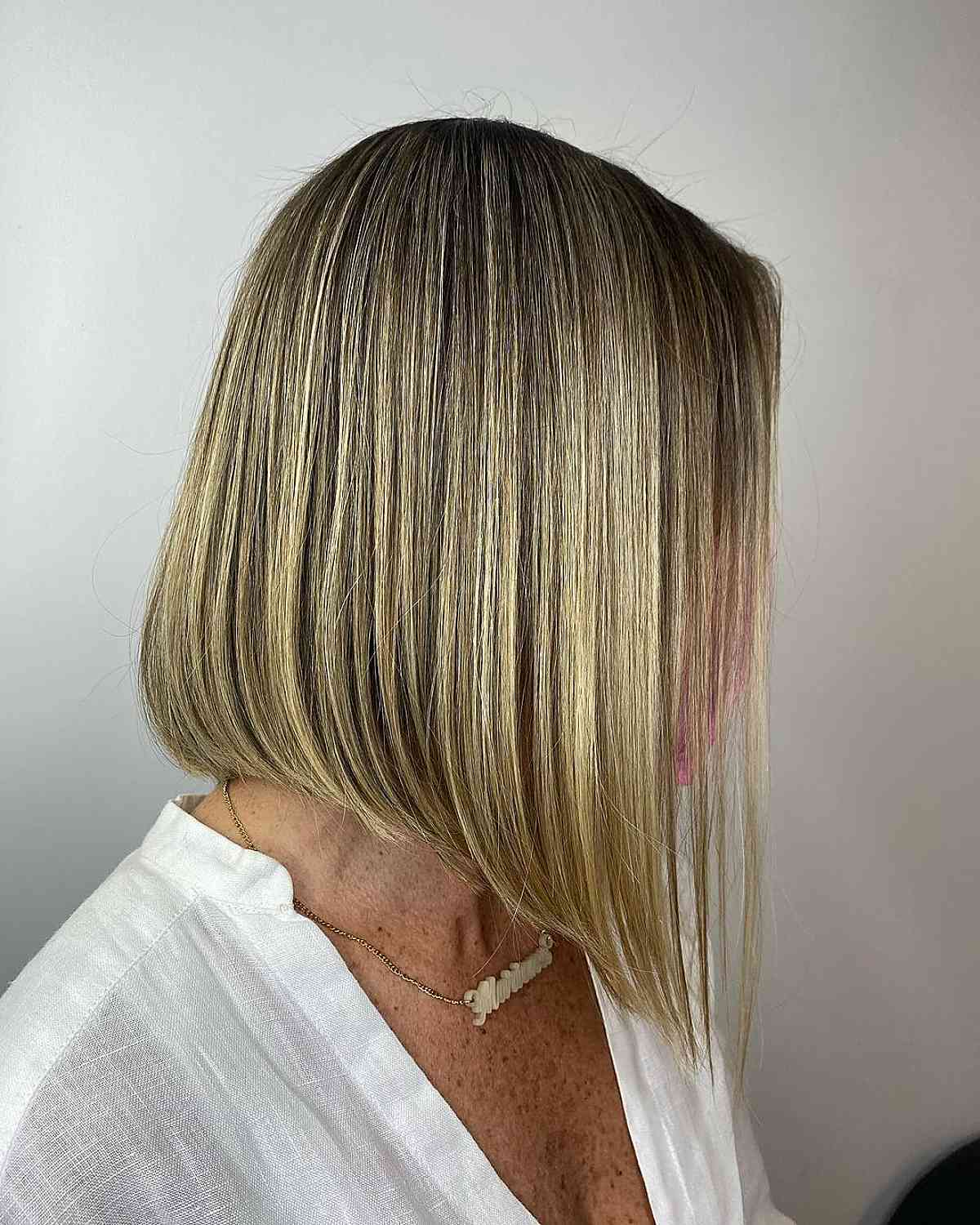 eye catching long blonde bob for ladies over 50