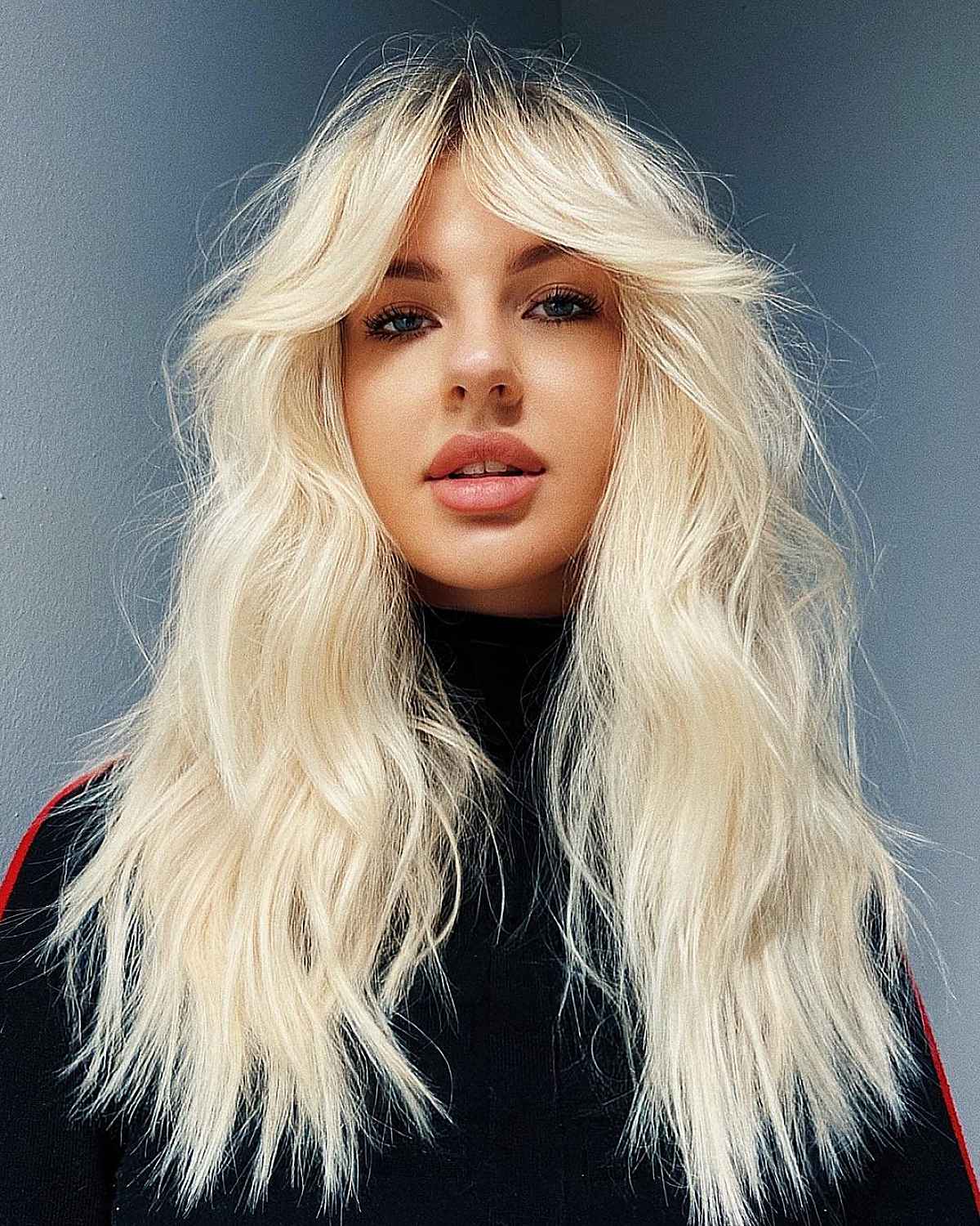 Long Blonde Hair with Curtain Fringe and Choppy Ends