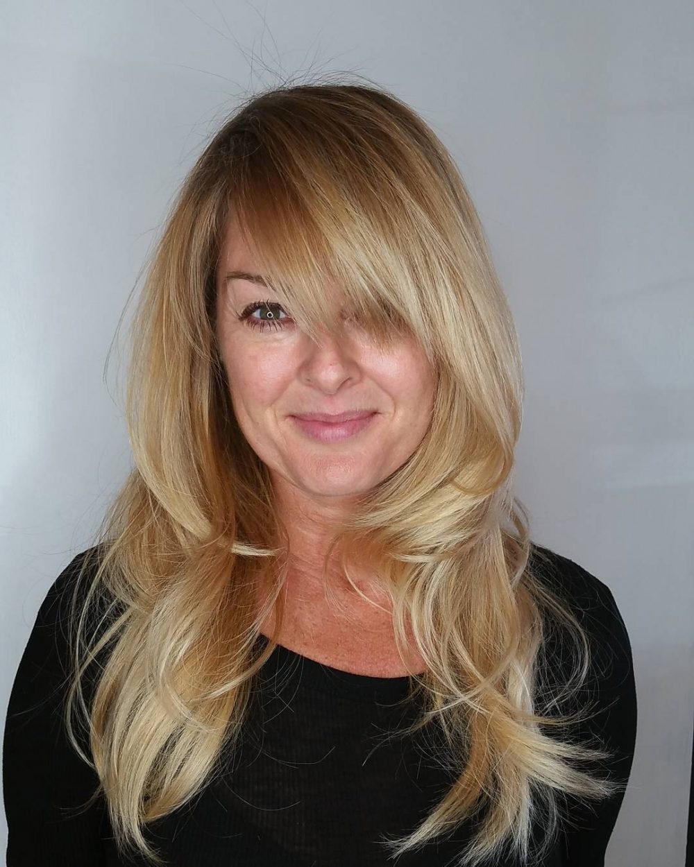 long blonde hair with side-swept bangs