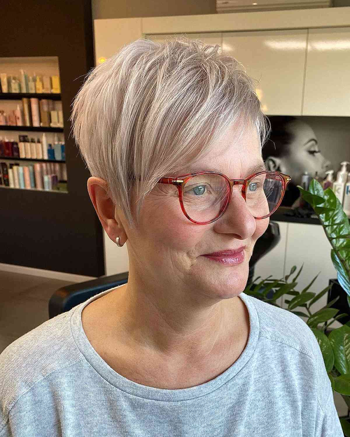 Long Blonde Pixie with Bangs for a Woman Over 50 with Glasses
