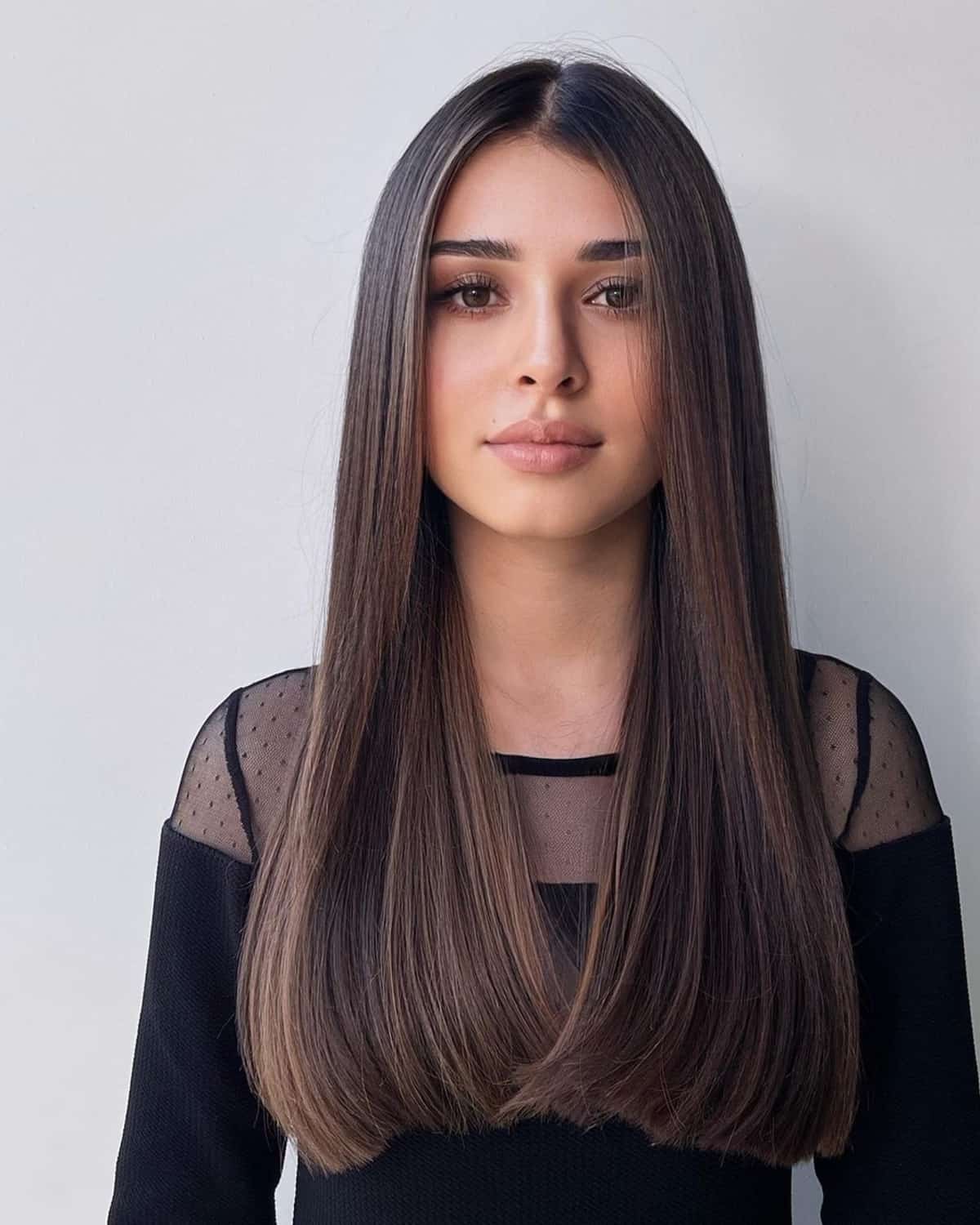 Long blunt cut hair with middle part