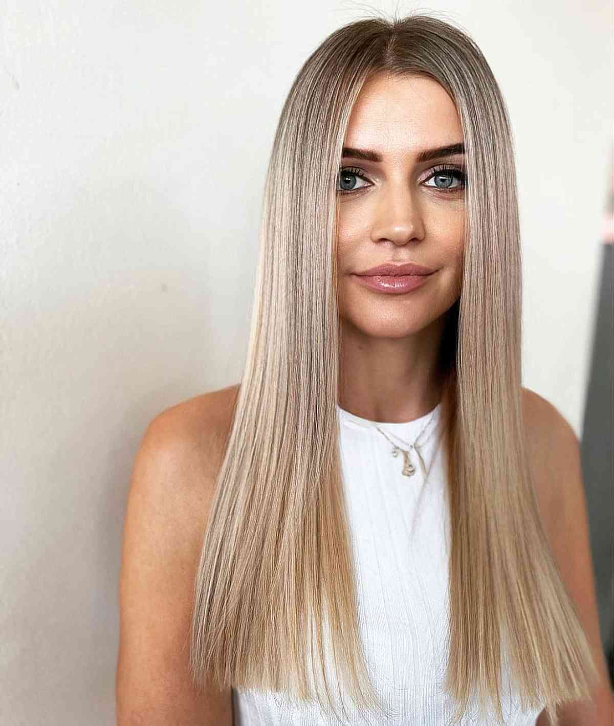 Long Blunt Vanilla Blonde Hair with an Off-Center Part