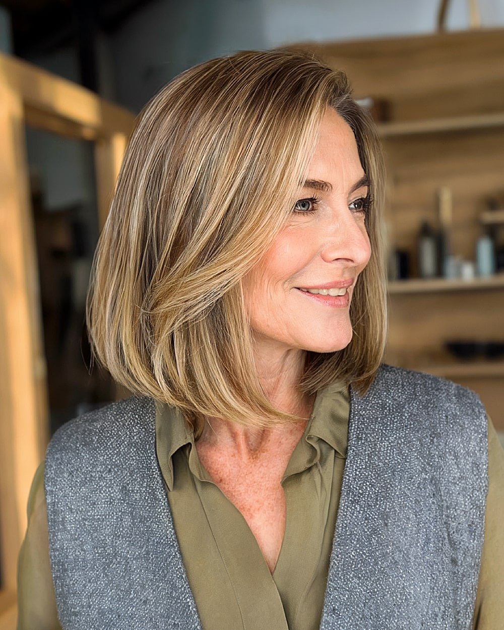 Angled long bob with face-framing layers for older women seeking structure and lift