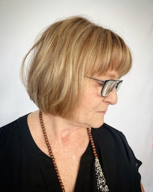 Youthful Long Bob hairstyle for older women over fifty with glasses and a round face