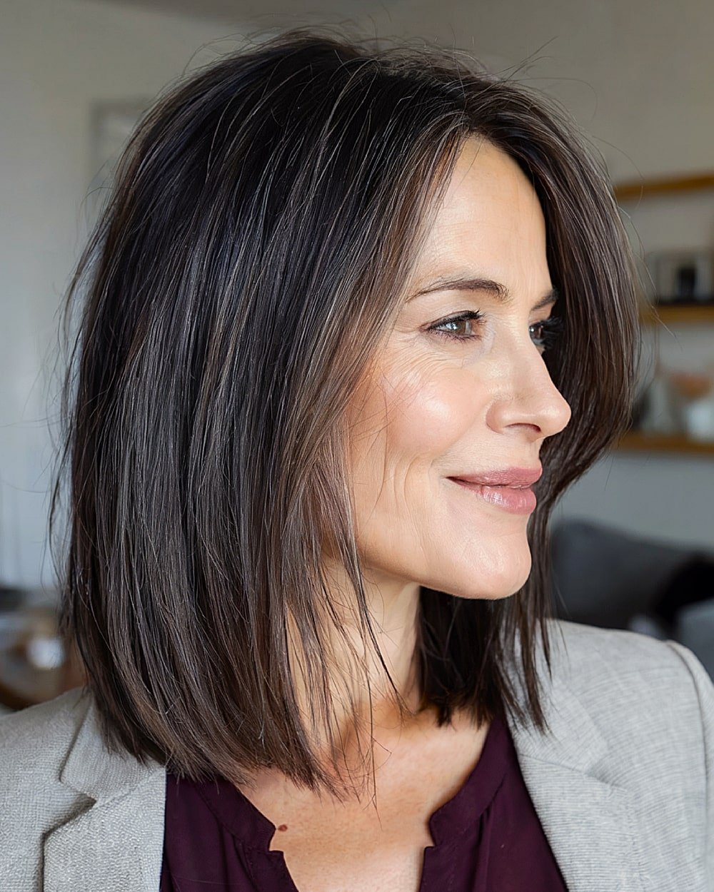 Long bob with razor cut ends for older women over 50 wanting lightness and swing