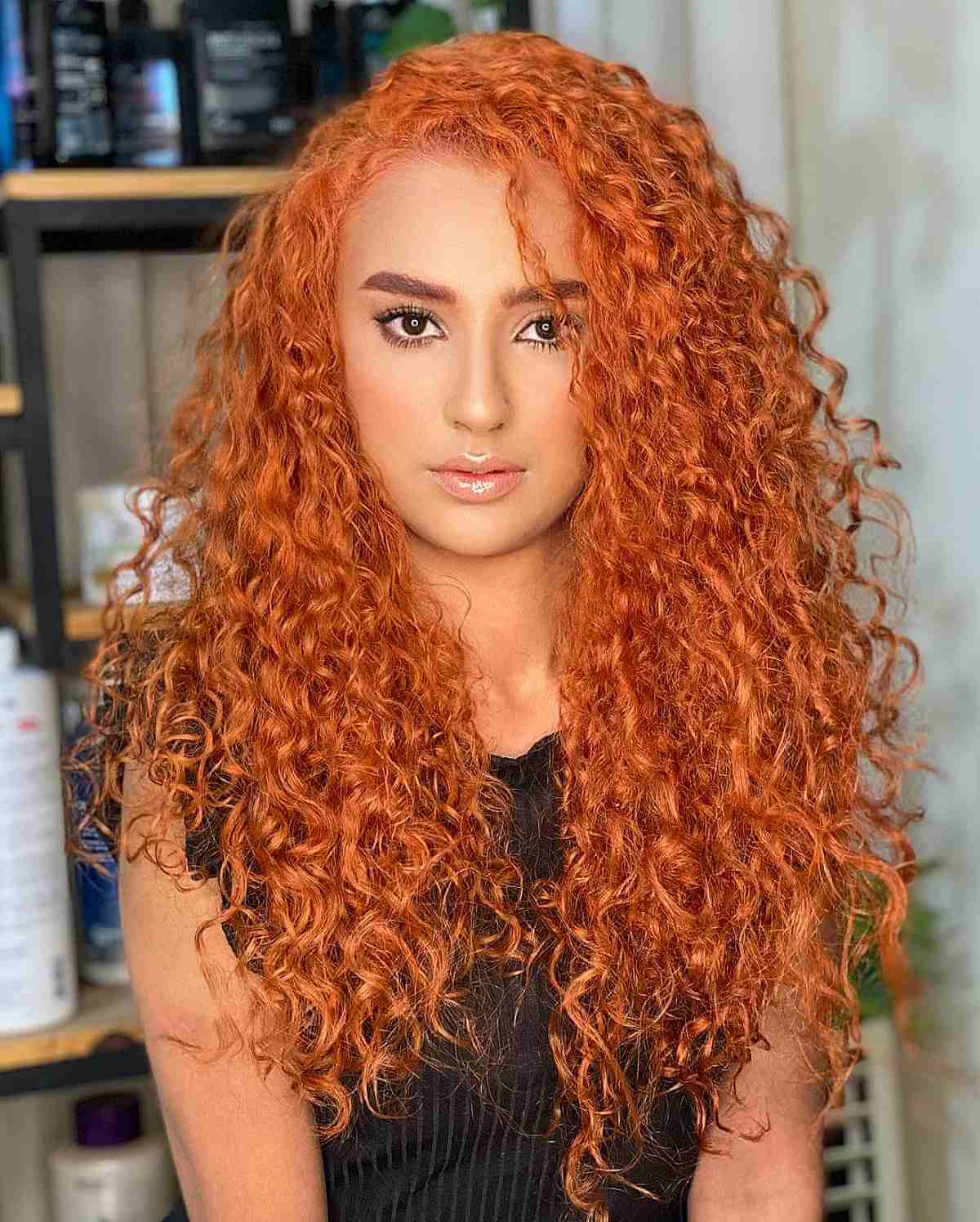 Long Bright Copper Curls with a Side Part