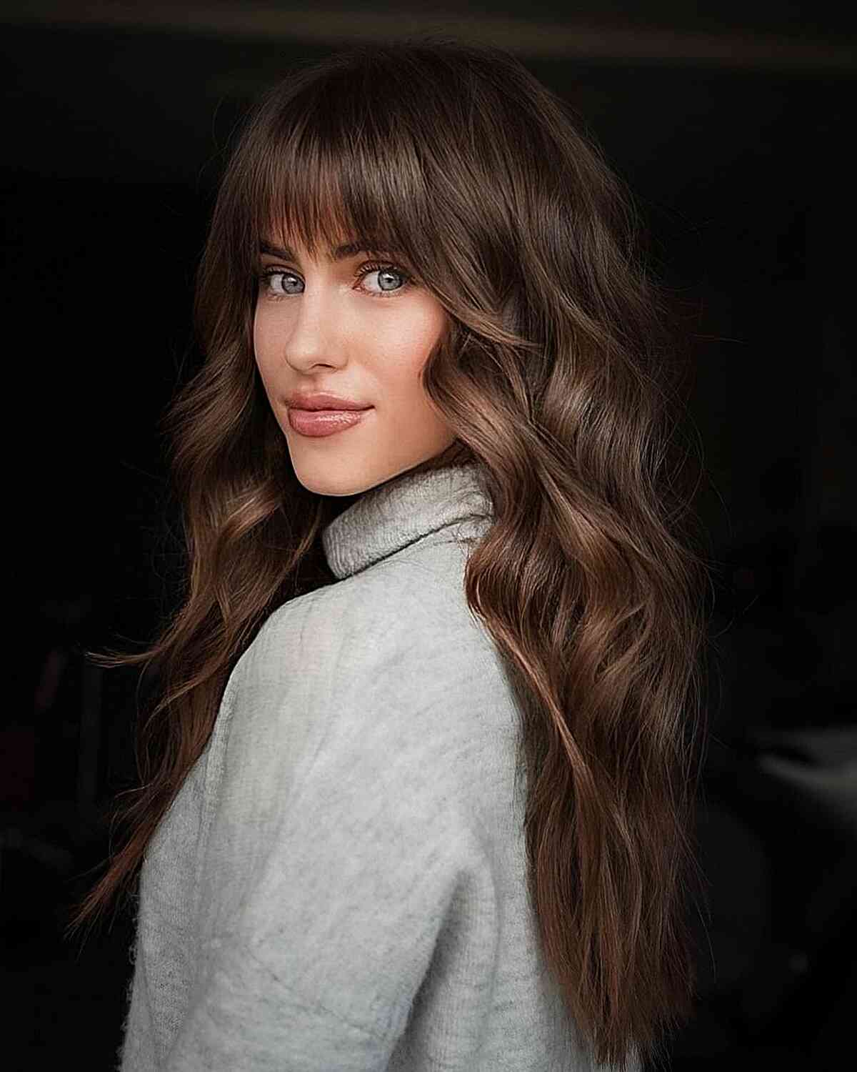 Long Brunette Hair with Bottleneck Bangs and Wavy, Subtle Layers