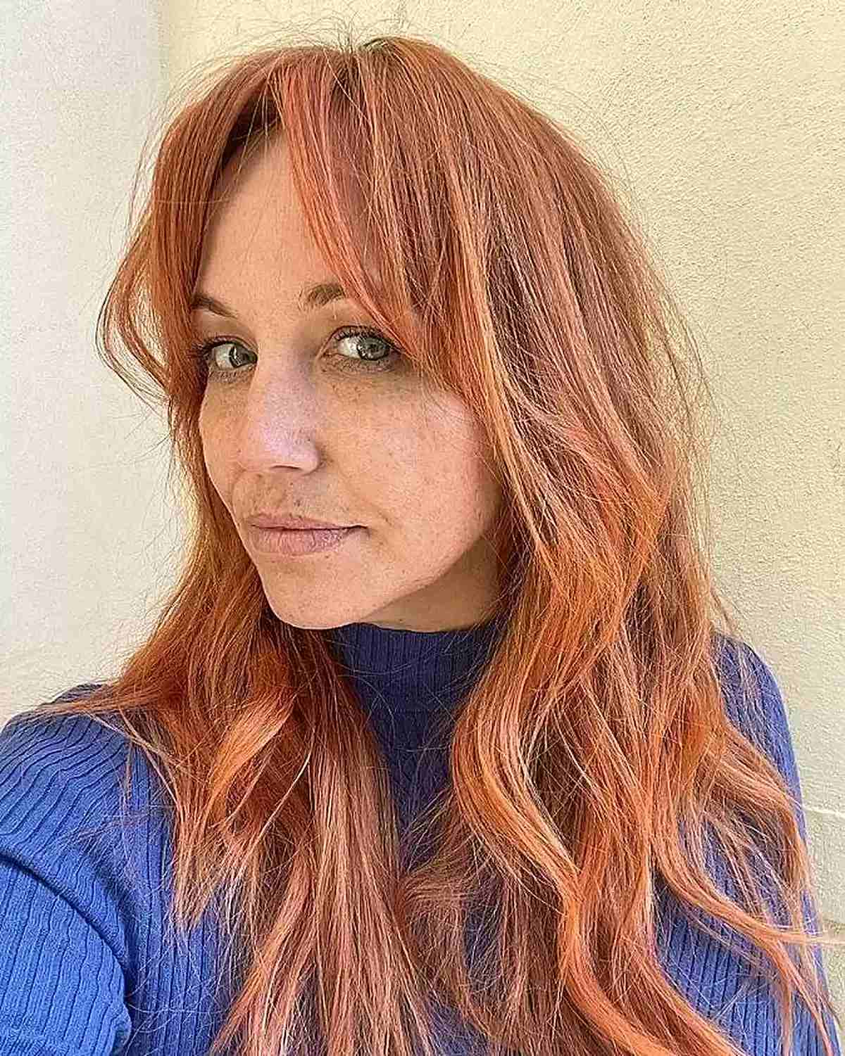 Long Copper Layers and Airy Bangs for Ladies in Their 50s