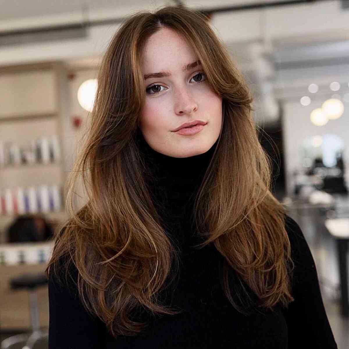 Long Curtain Bangs and Blowout Layers on Light Brown Hair