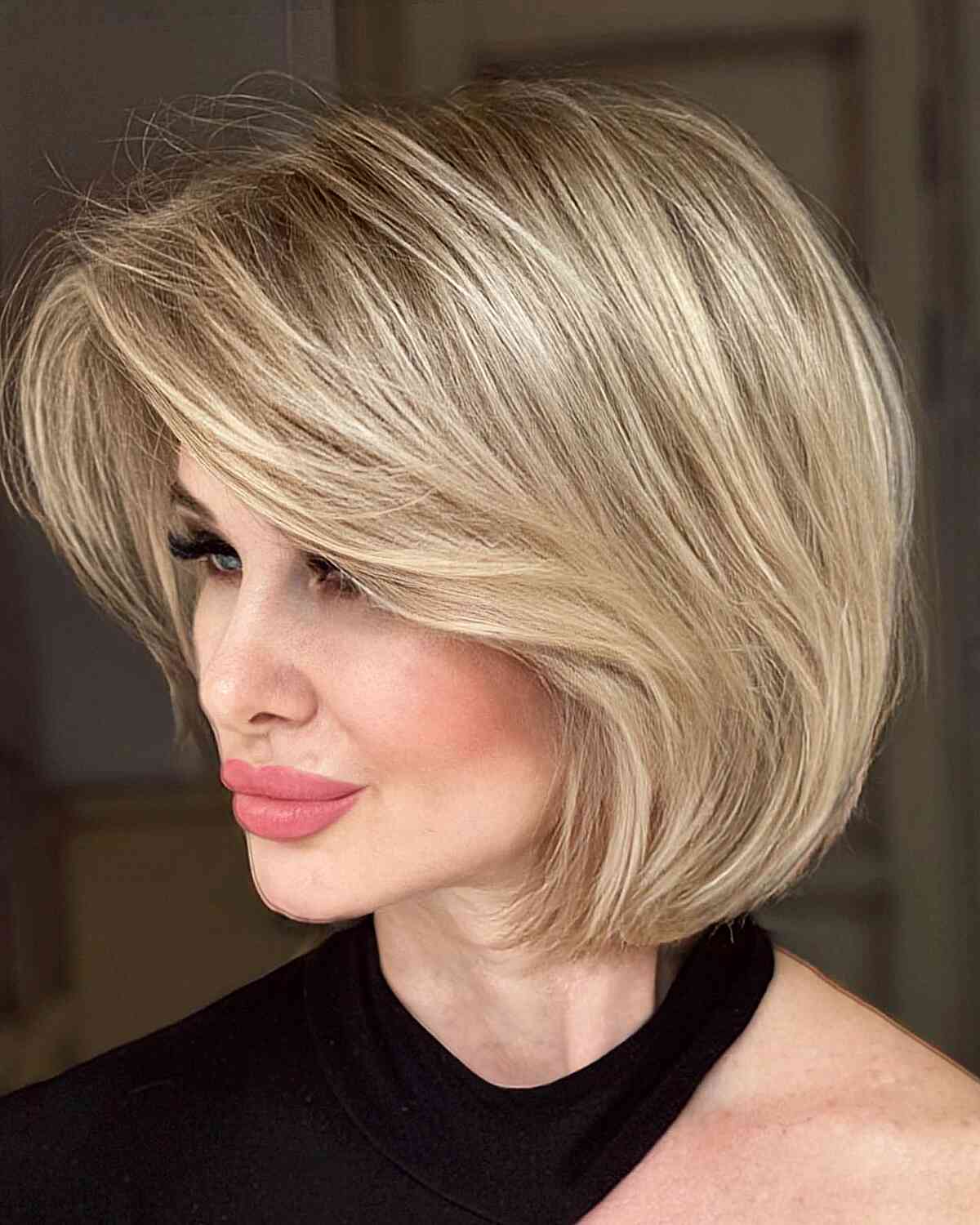 Long Curtain Bangs on a Layered Bob for women with short blonde hair