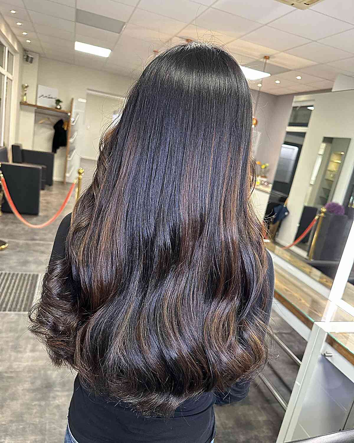 Long Dark Black Hair with Subtle Waves and Cinnamon Brown Balayage Accents