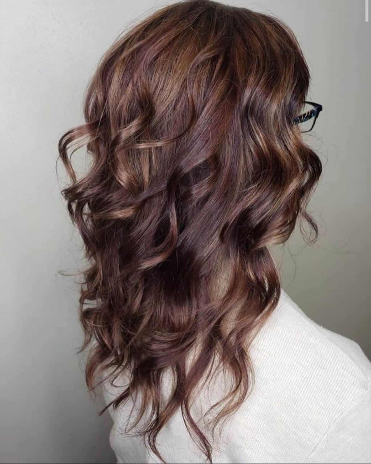 long dark burgundy brown hair with caramel highlights