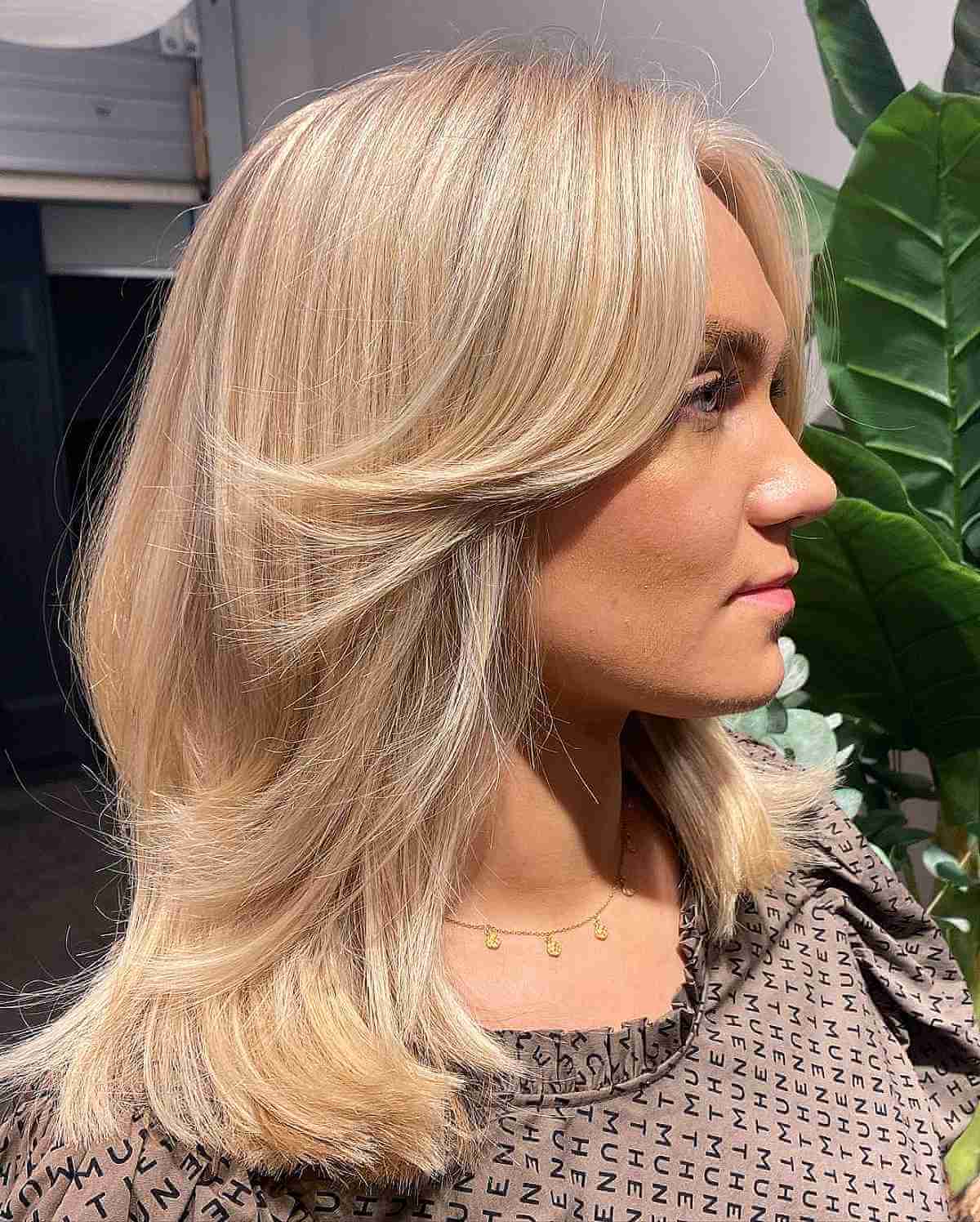 Long Blonde Feathered Curtain Bangs