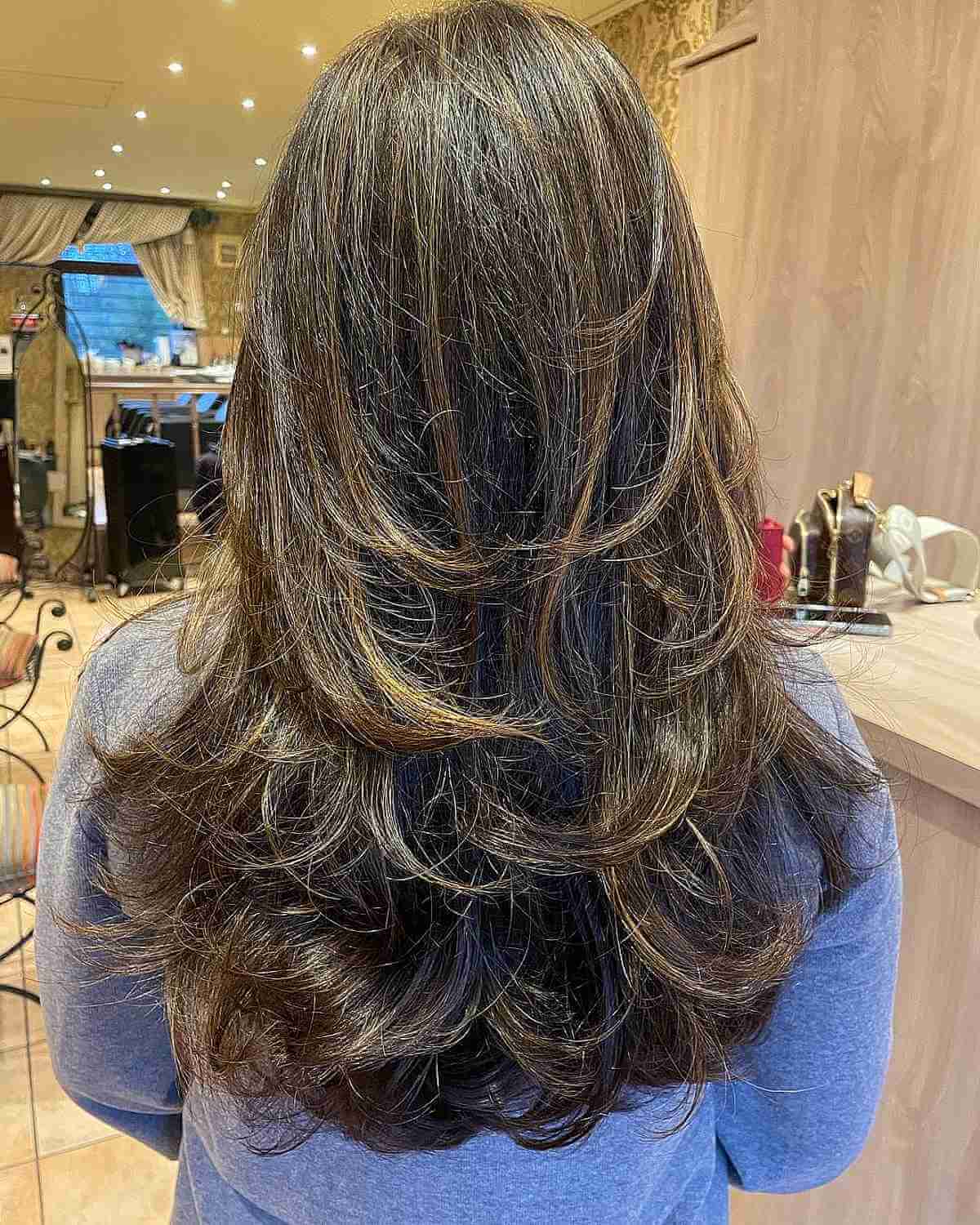 Long Feathered Layered Cut with Accented Caramel Tones
