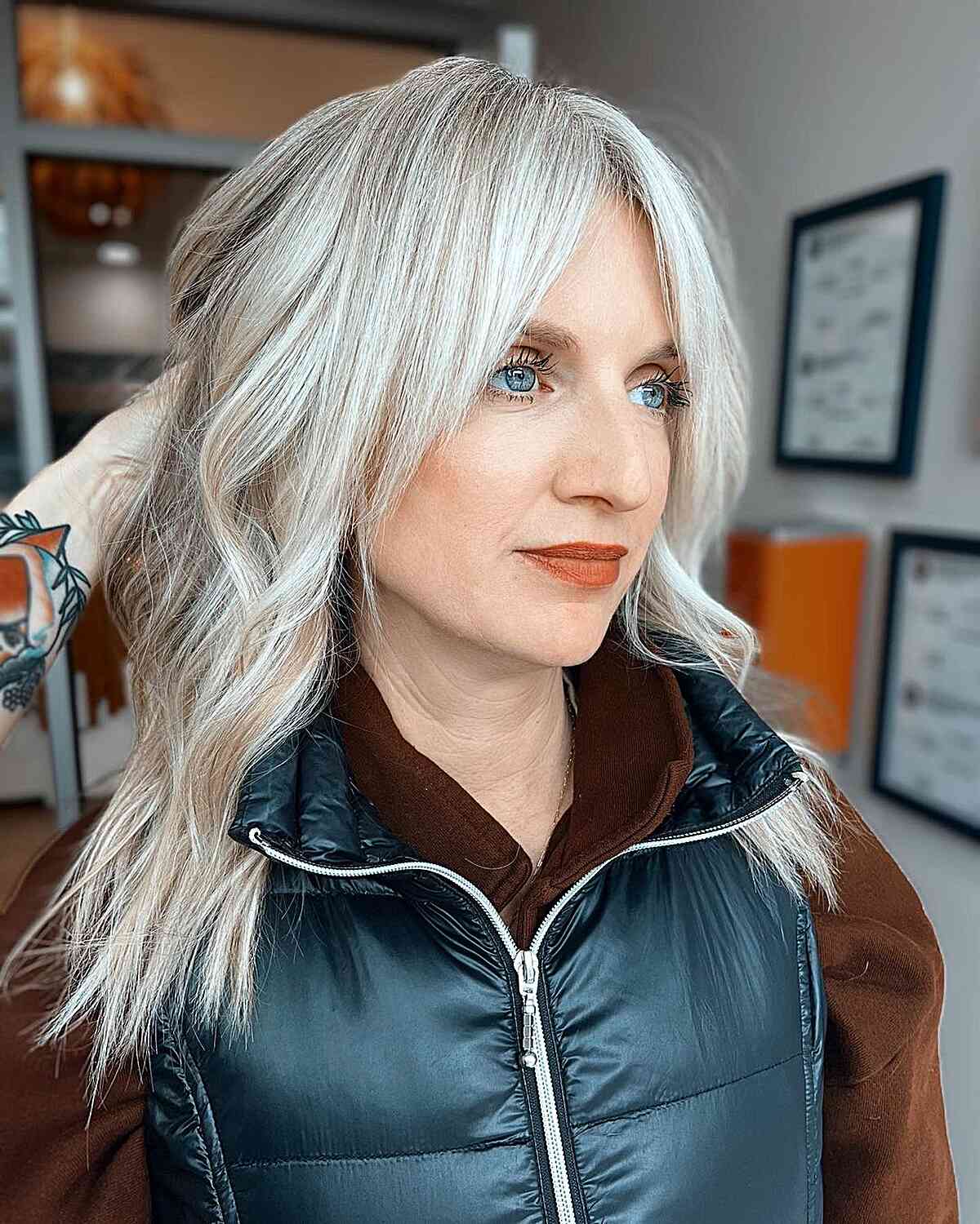 Long grey hair with curtain bangs for older women