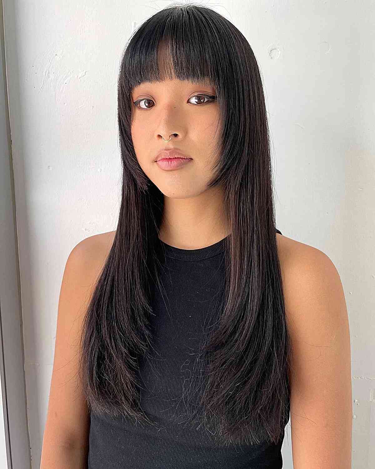 Long Hime Cut with Straight Layers and Bangs for Women with Longer Face Shape