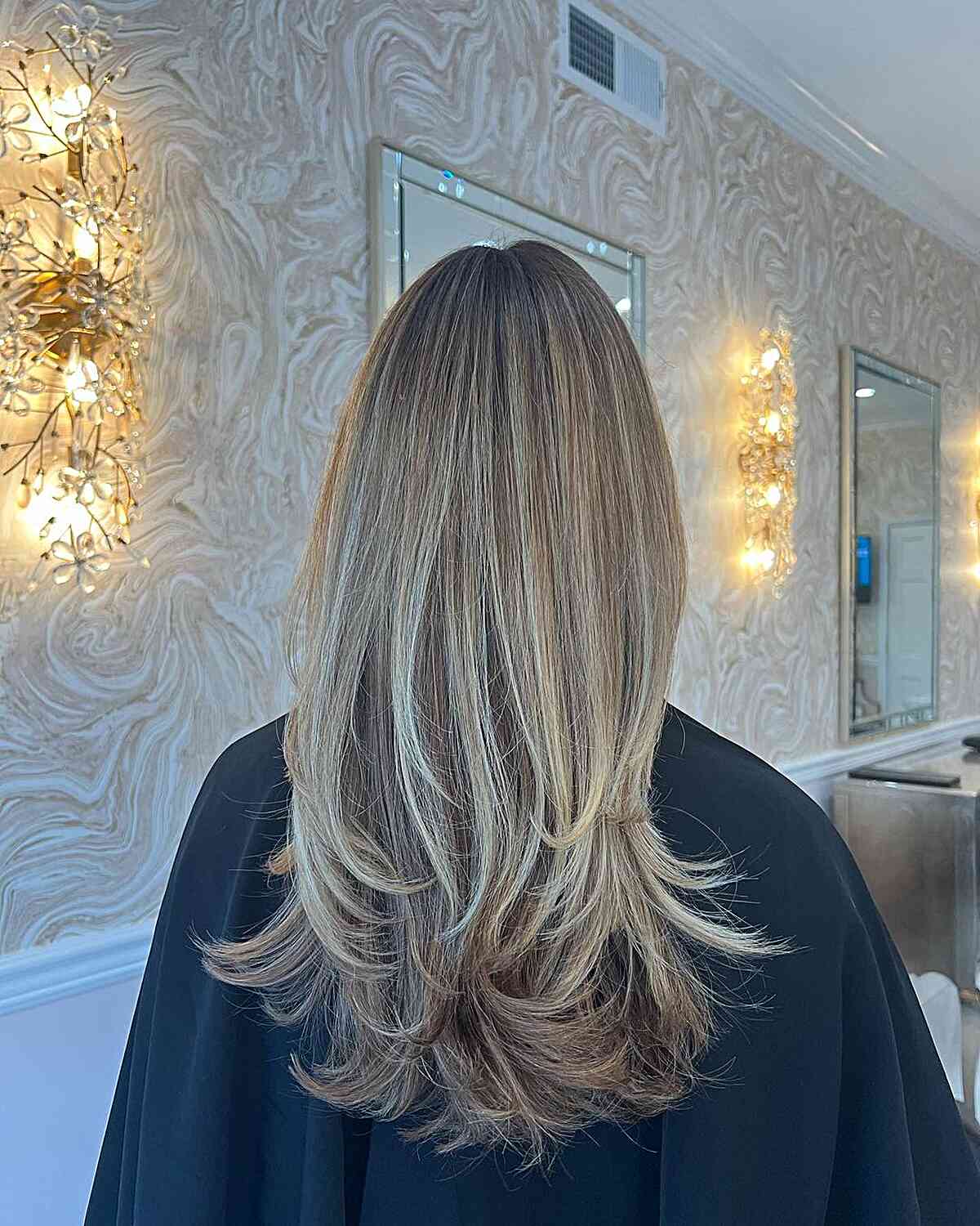 Long Layer Cut with Feathered Ends for Dimensional Blonde Hair