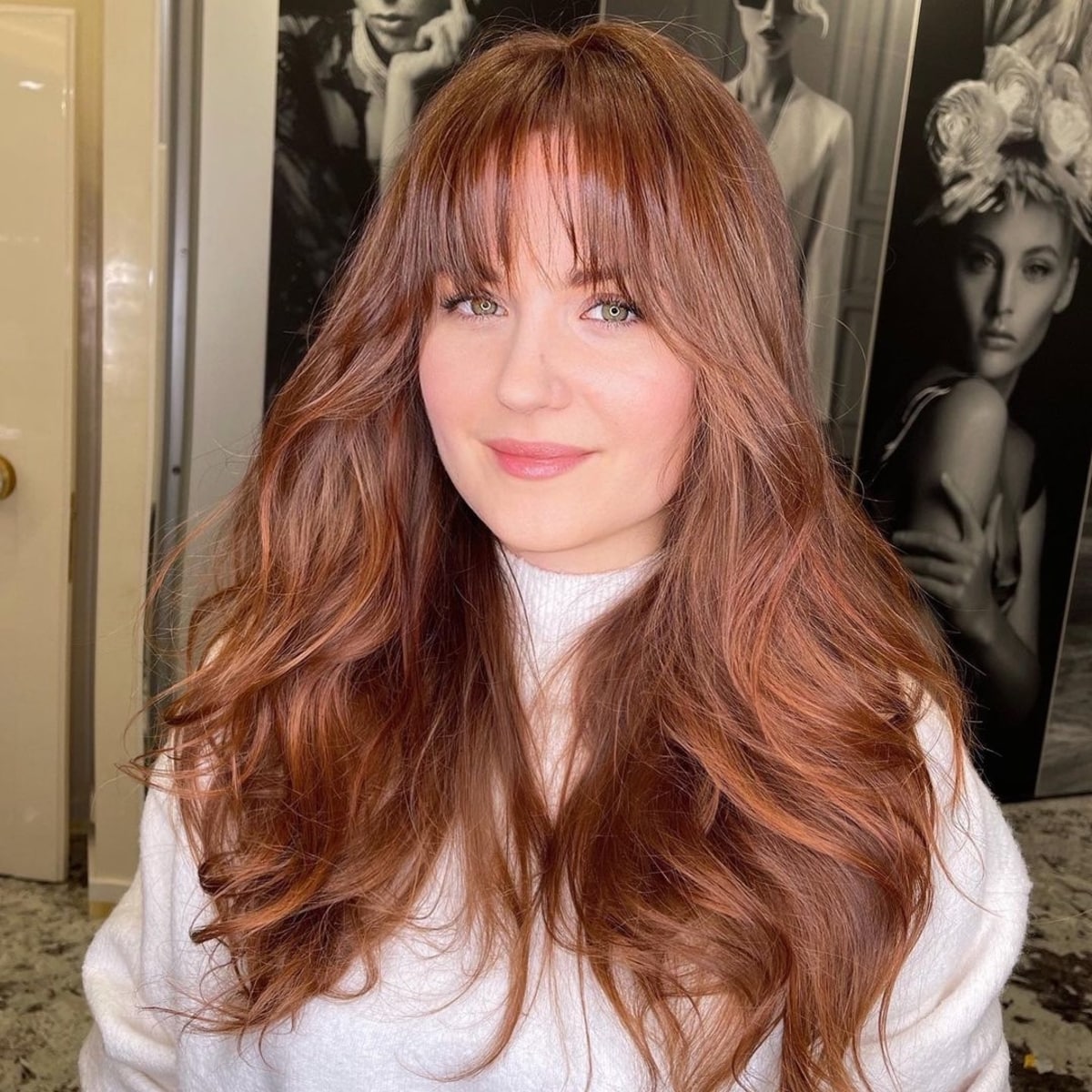 Feminine long layered hair with arched bangs