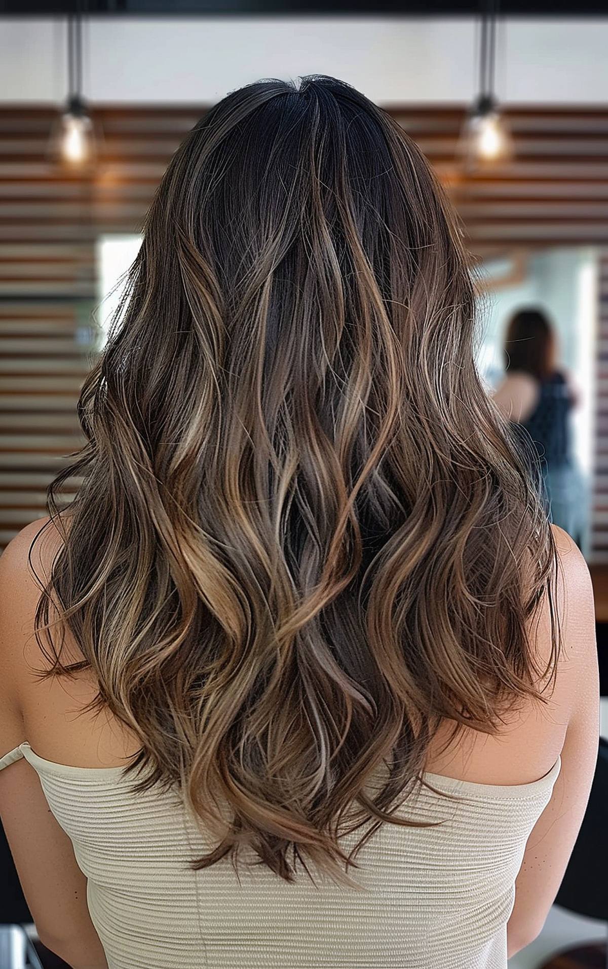 Back view of long, wavy layered haircut for thick hair