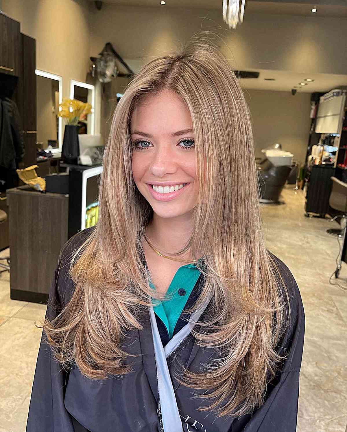 Long-Length Layered Feathered Blonde Hair with Off-Center Part Style