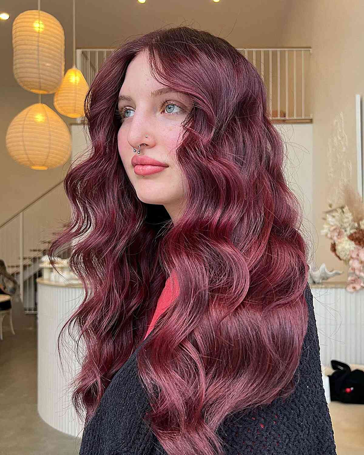 Long Middle-Parted Burgundy Waves on Women with Fair Skin