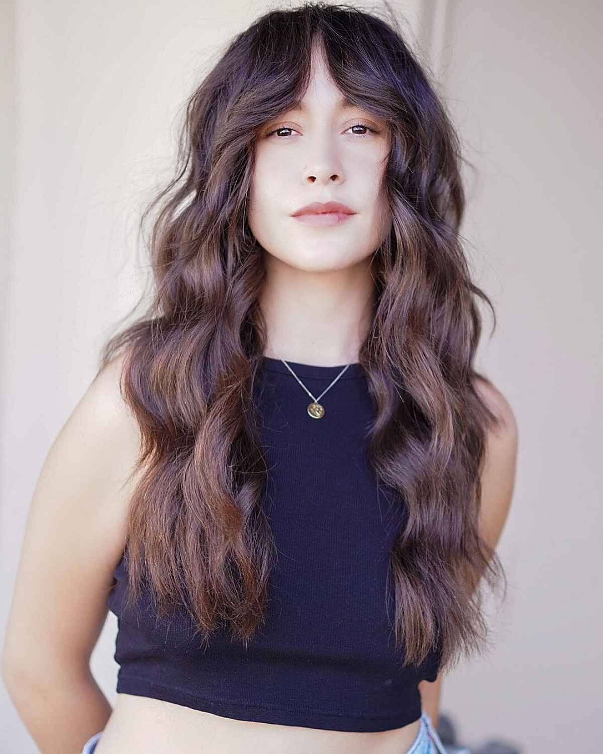 long natural brunette hair with curtain bangs