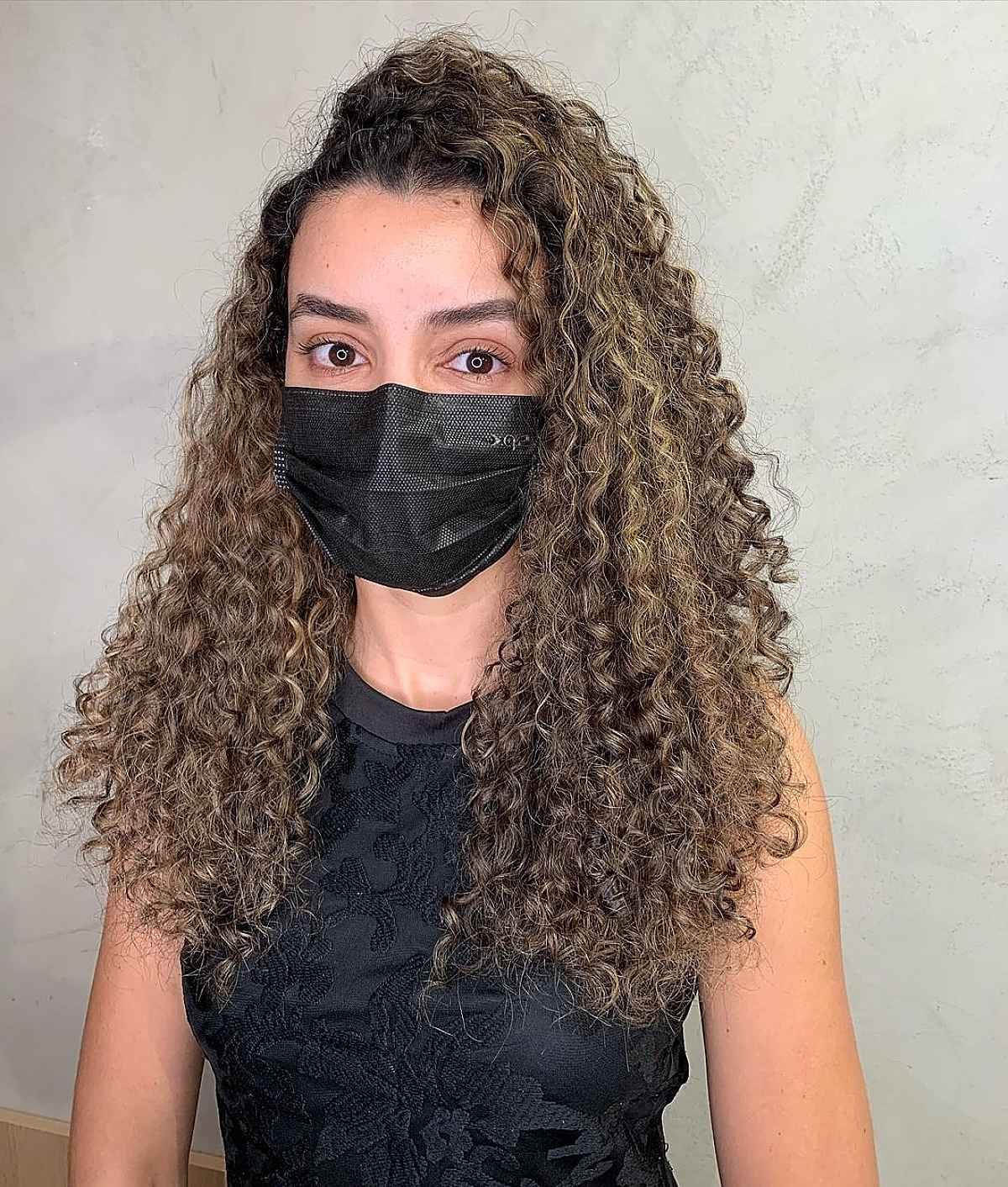 Long Natural Curls with a Deep Side Part
