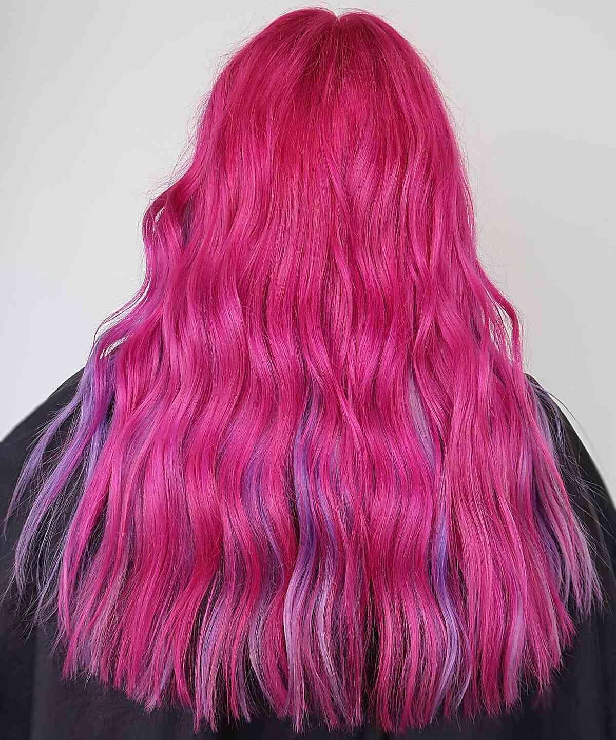 Long Pink Hair with Pops of Purple Tones for women with an edgy style