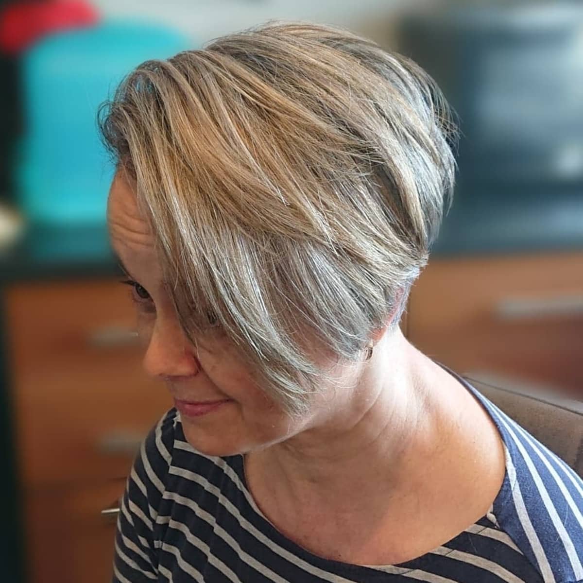 Wash-and-go long pixie cut for women over 50 with round faces