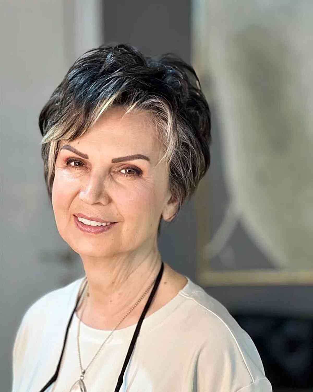 Long Pixie with Blonde Peekaboo Highlights for Ladies in Their 60s