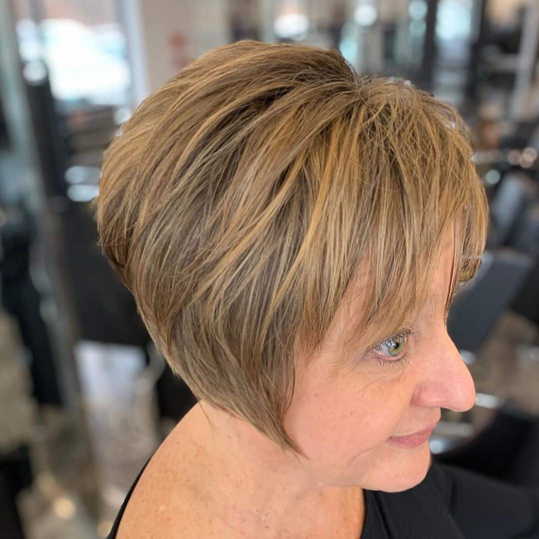 long pixie with choppy bangs on 50 year old woman