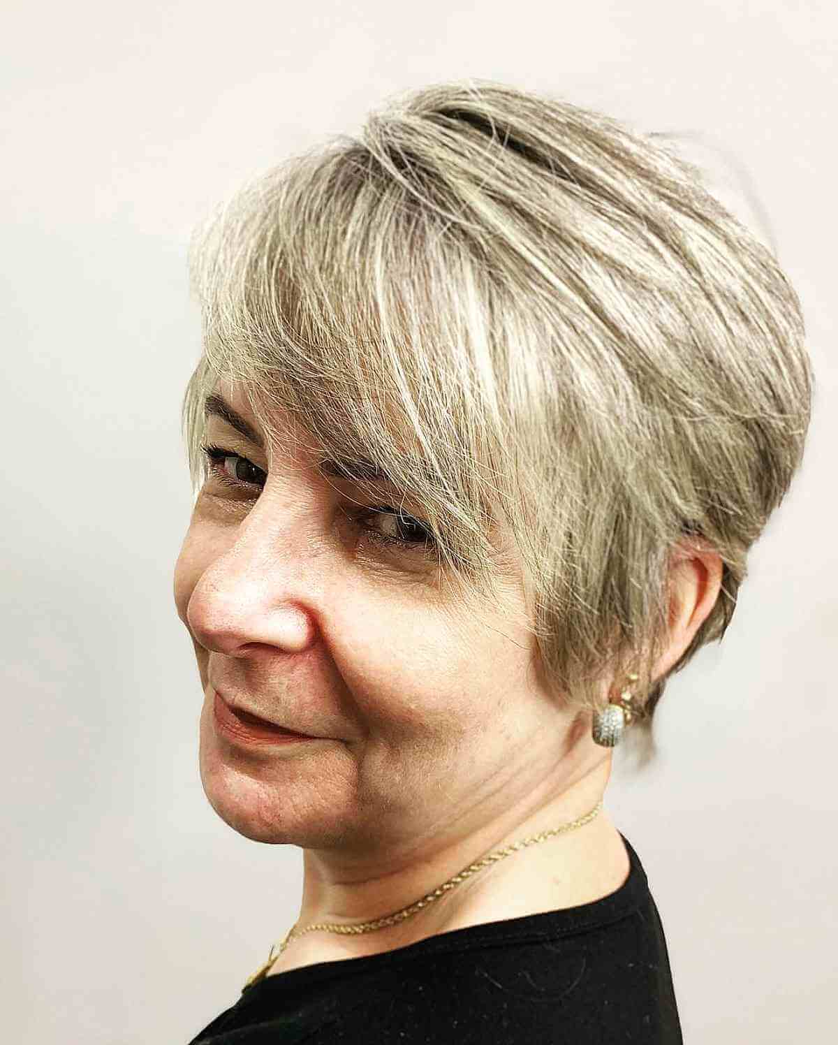 Long pixie with bangs for a 60-year-old woman