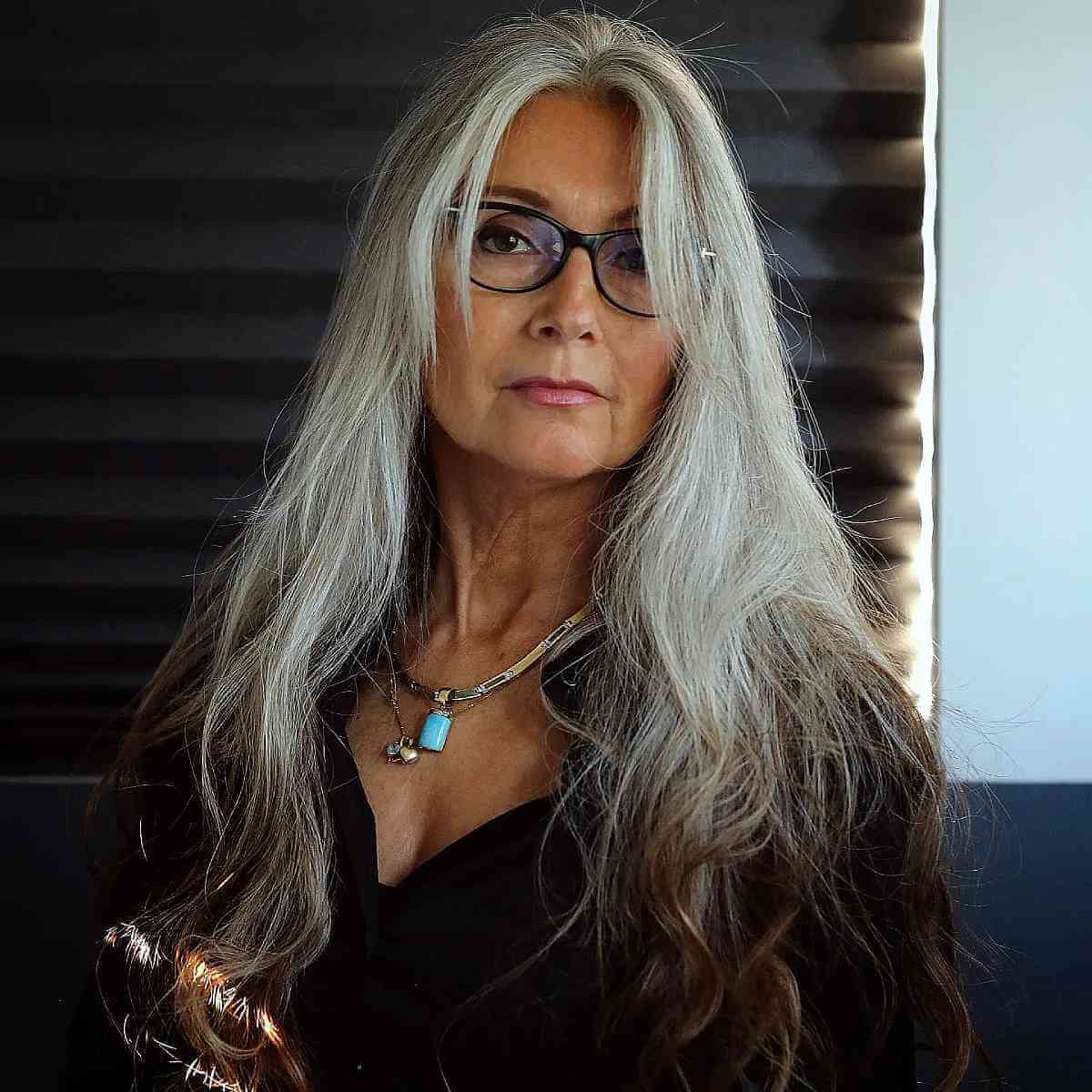 Long Silver Hairstyle for Women Over 50 with Glasses