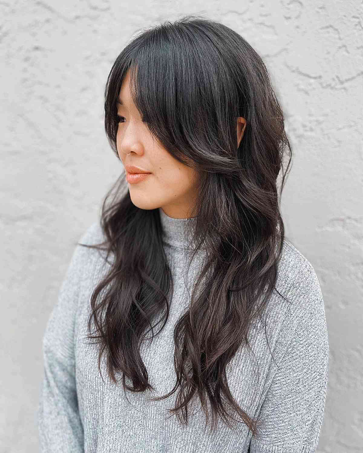 Long soft shag with loose waves and face framing
