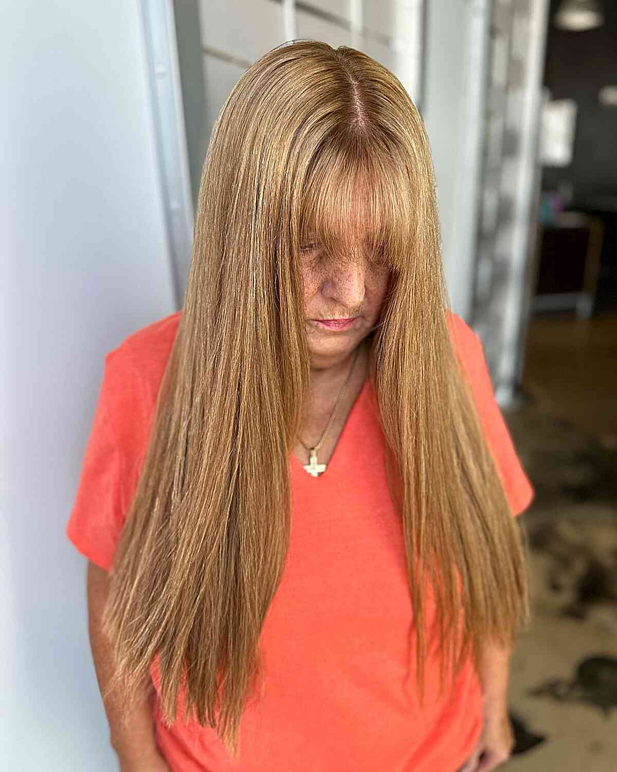 Long Straight Hair with Choppy Ends and Thin Bangs for Women Over 50