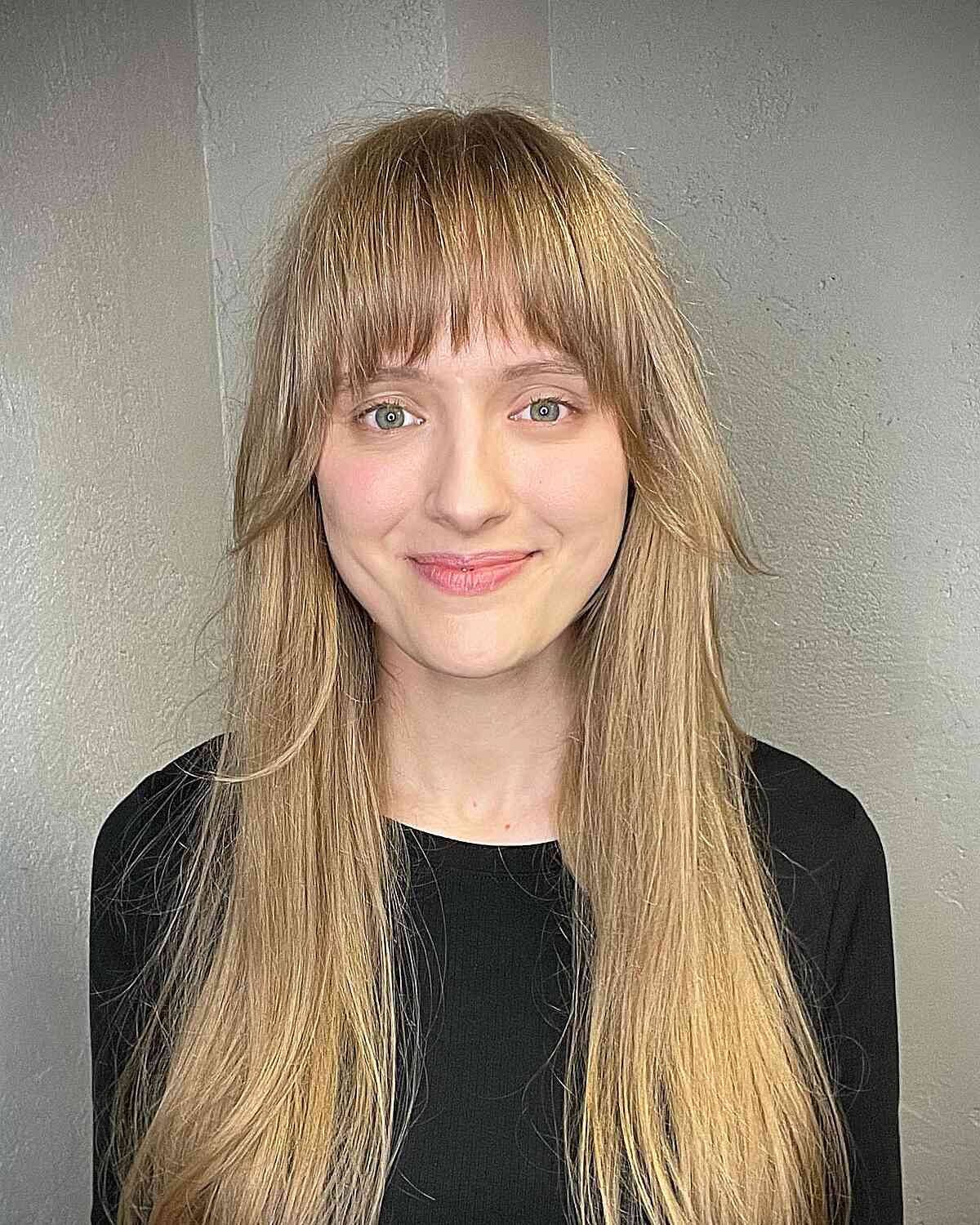Long Straight Hair with Full Choppy French Bangs for Round Faces