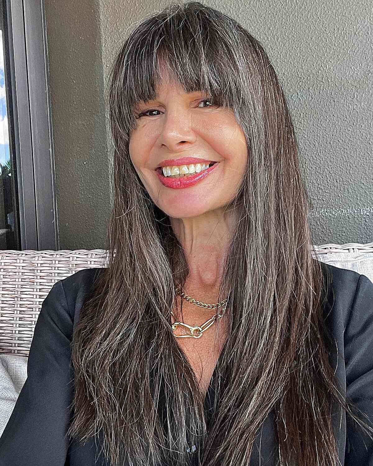 Long Subtle Layers with French Bangs for Mature Women Over 50