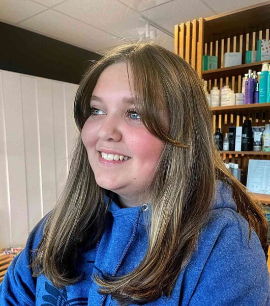 A Long Swoopy Bangs on Medium-Cut Dark Blonde Hair and Women with Chubby Cheeks
