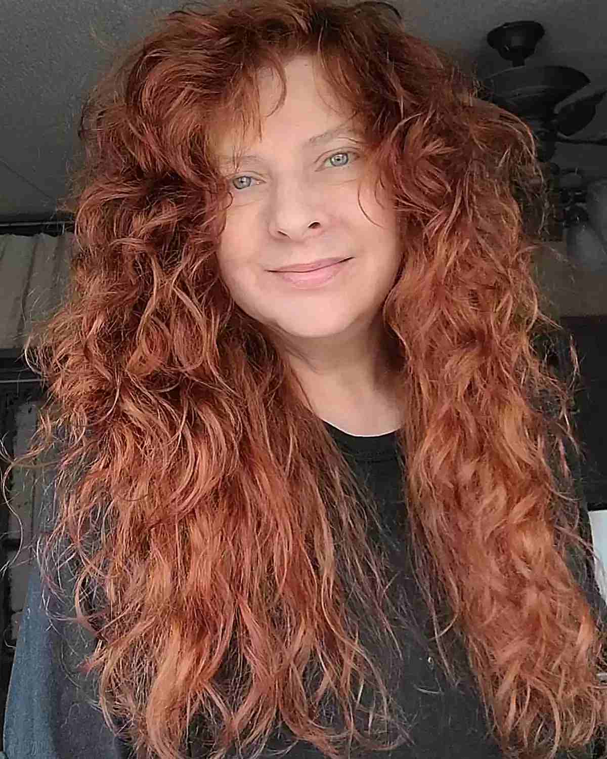 Long Textured Curls with Subtle Side Bangs for Women of Age 50