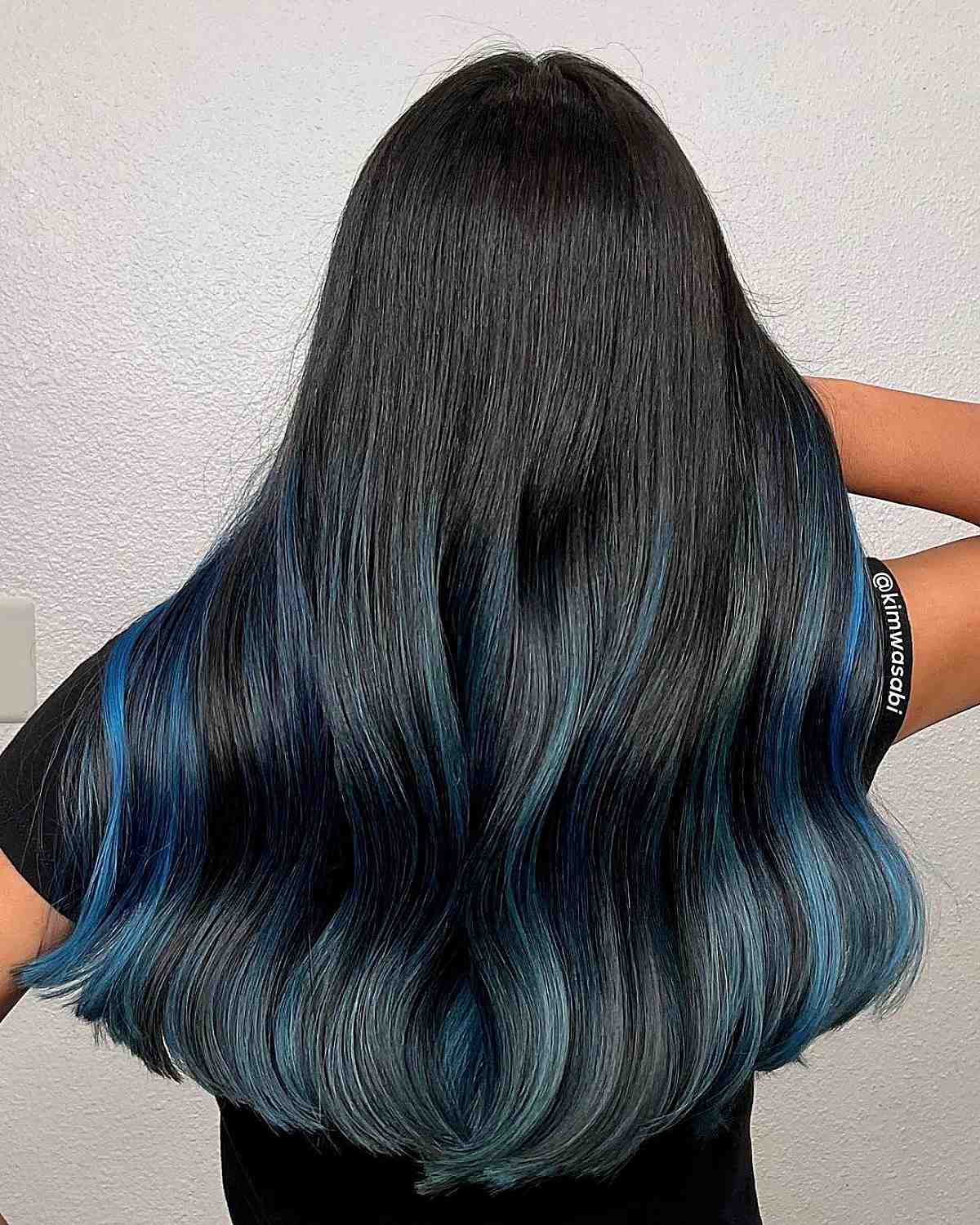 long, thick black hair with blue highlights