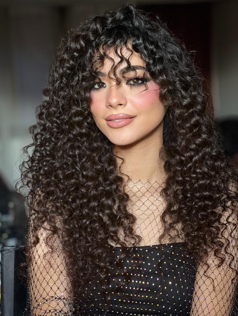 Long Voluminous Curly Cut with Curtain Bangs