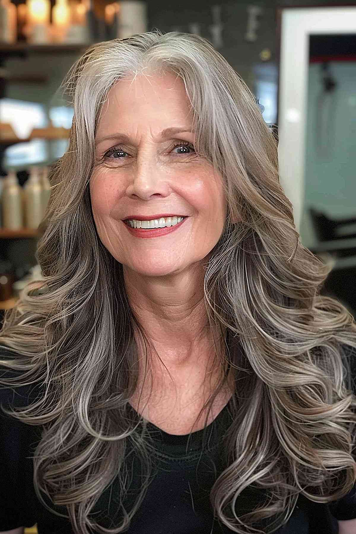 Long Wavy Hair with Center Part for a woman in her 60s