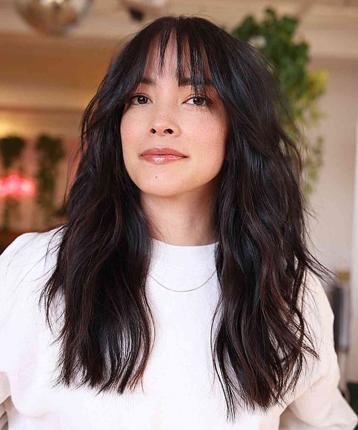 Long Wavy Layers with Piece-y Bangs on Women with Square Face Shape
