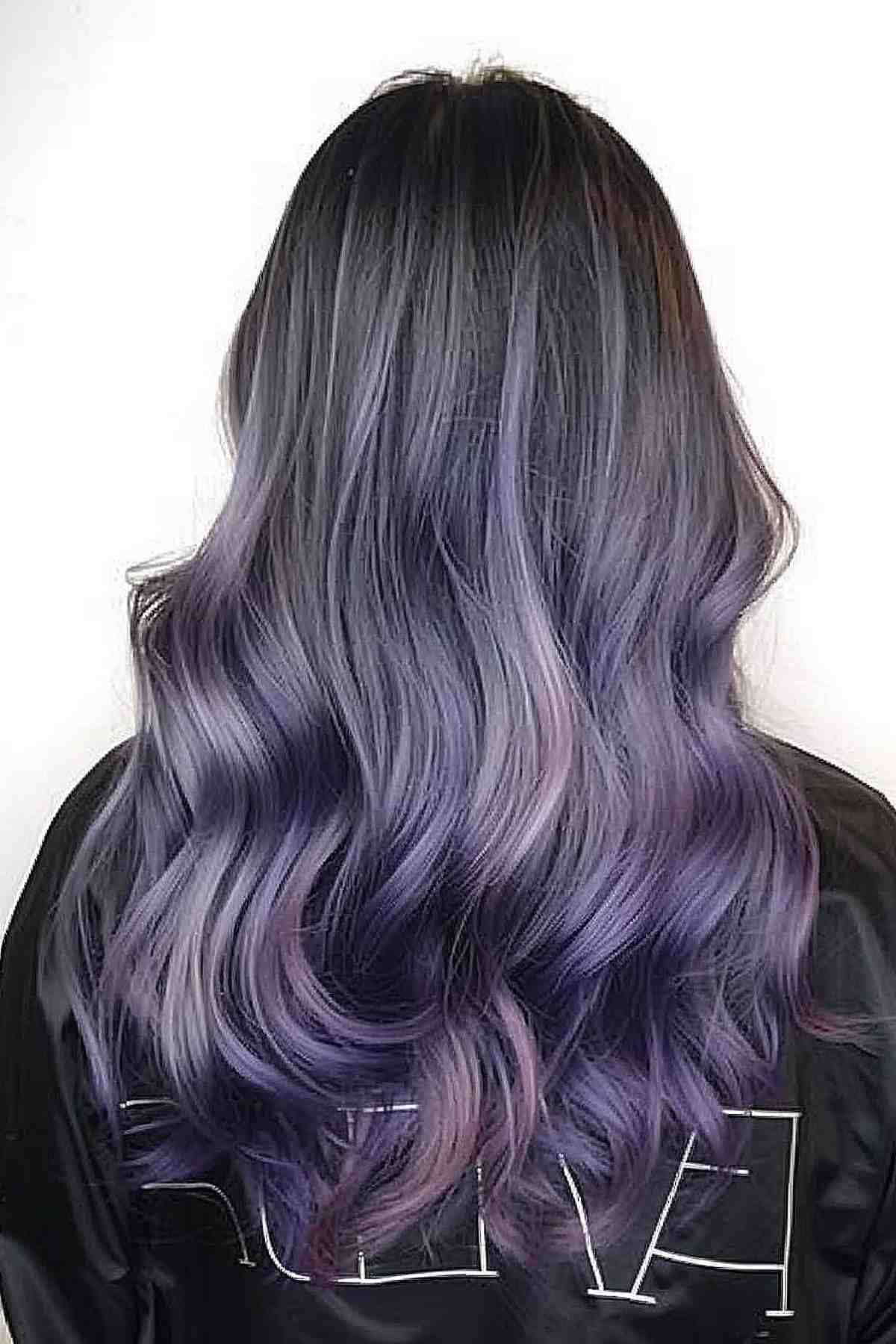 Long thick hair with wavy purple to grey ombre transition