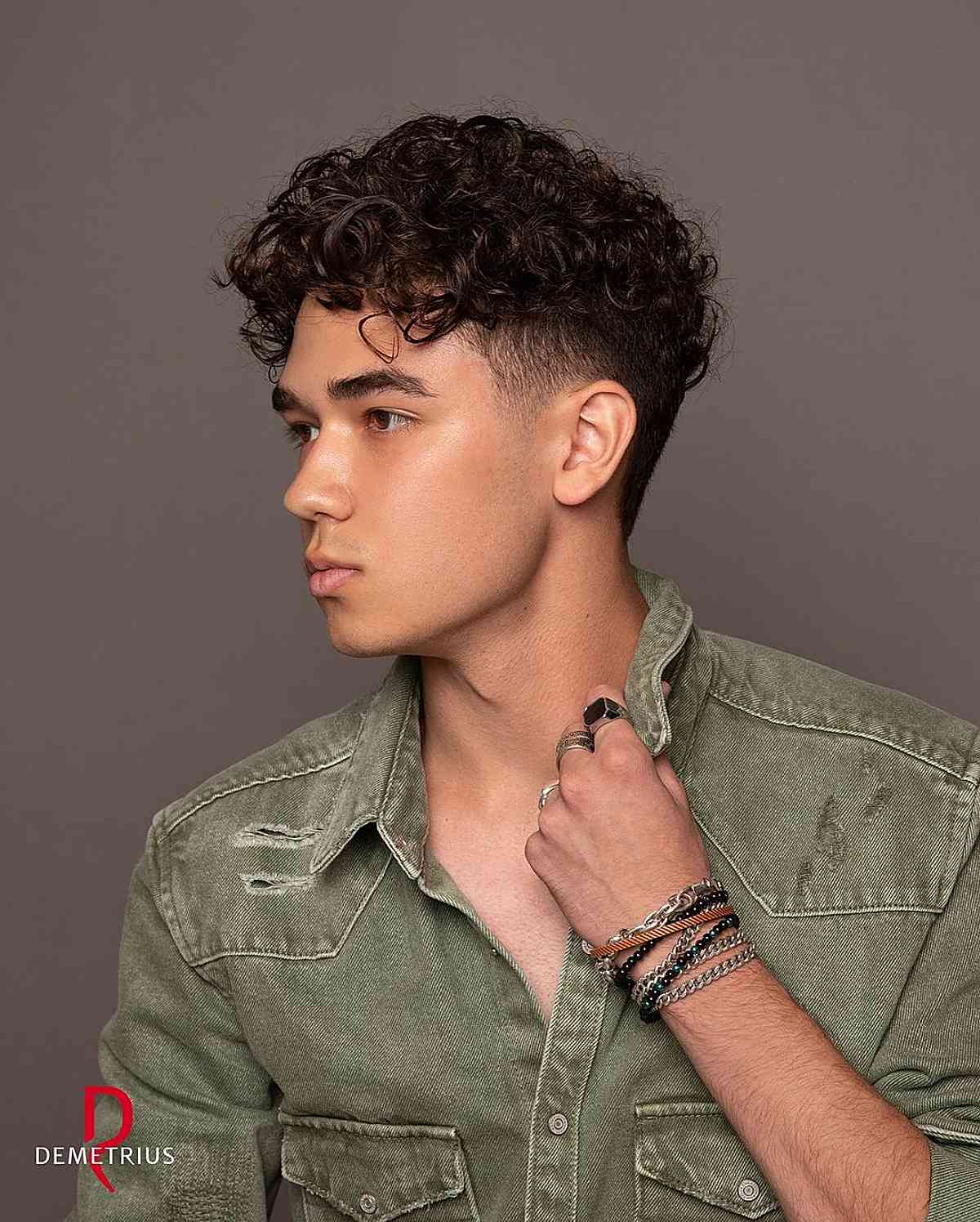longer curly hair on top with short sides