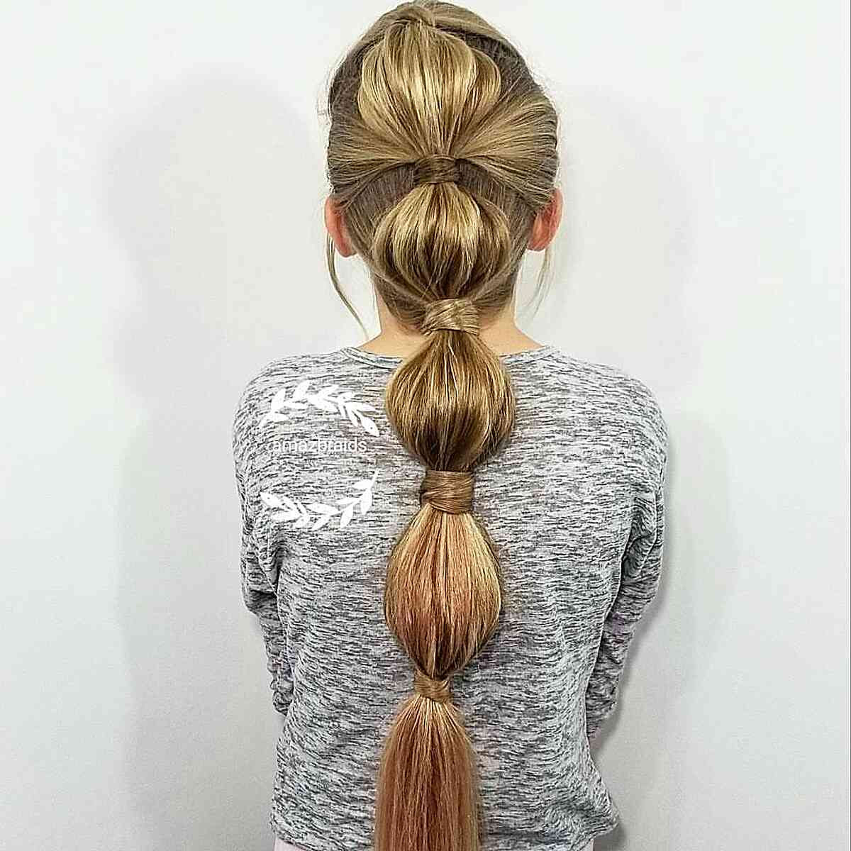 Loose Bubble Braid Hairstyle for Young Girls who Play Softball