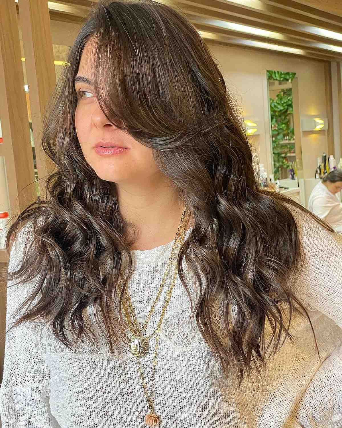 Loose Curls with Side Bangs for Round Faces