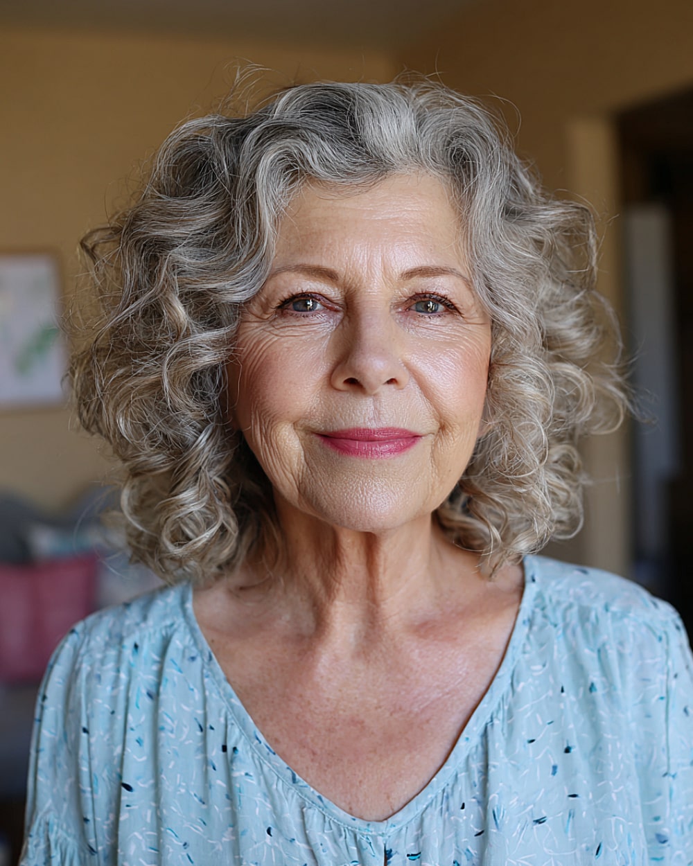Loose curls for women over 70 with natural silver tones and soft layers