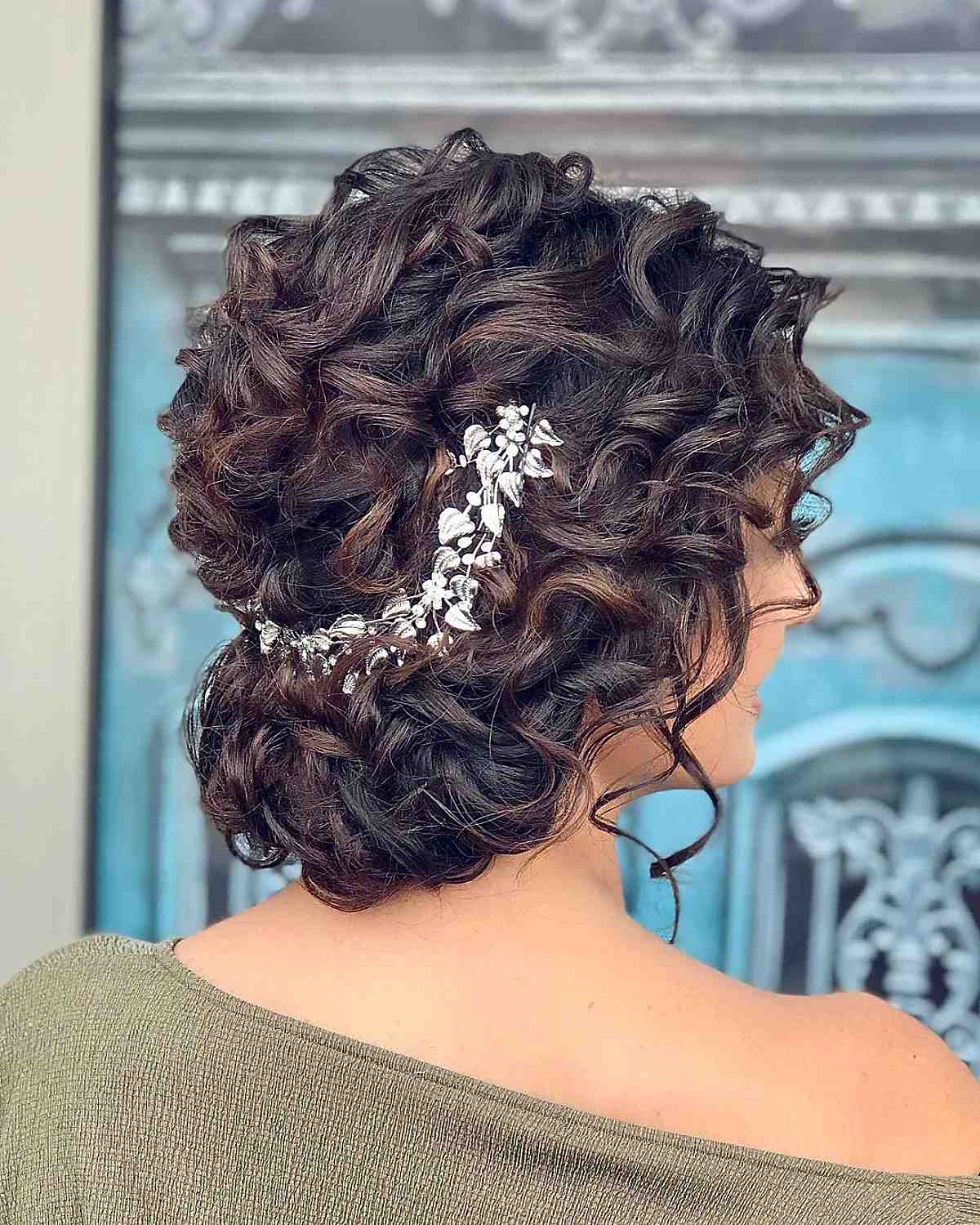 loose curly updo with accessories