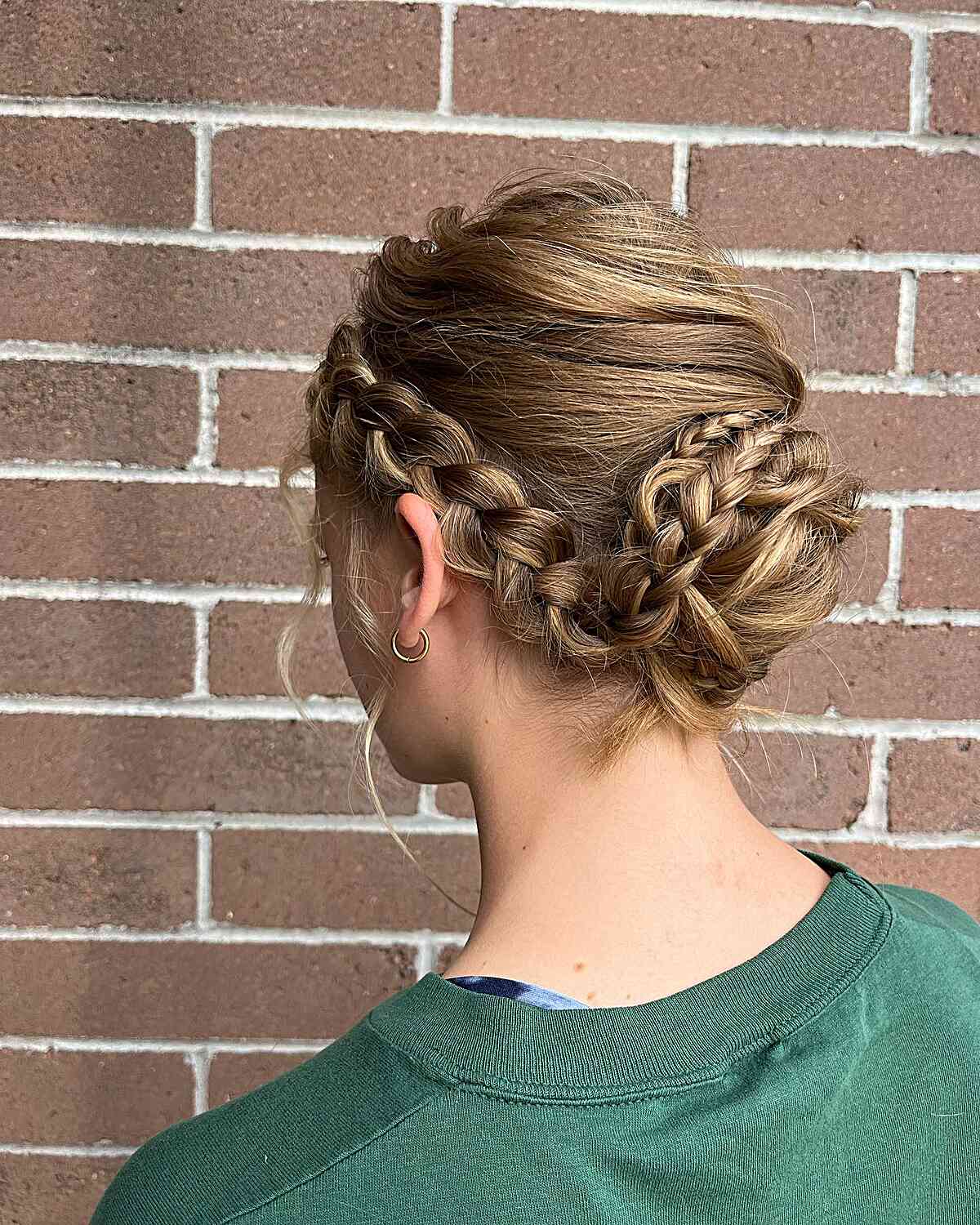 Loose Low Bun with Side Braids for Wedding Attendees